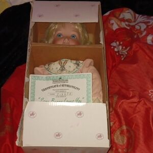 Collectible Porcelain Doll with Blonde Hair